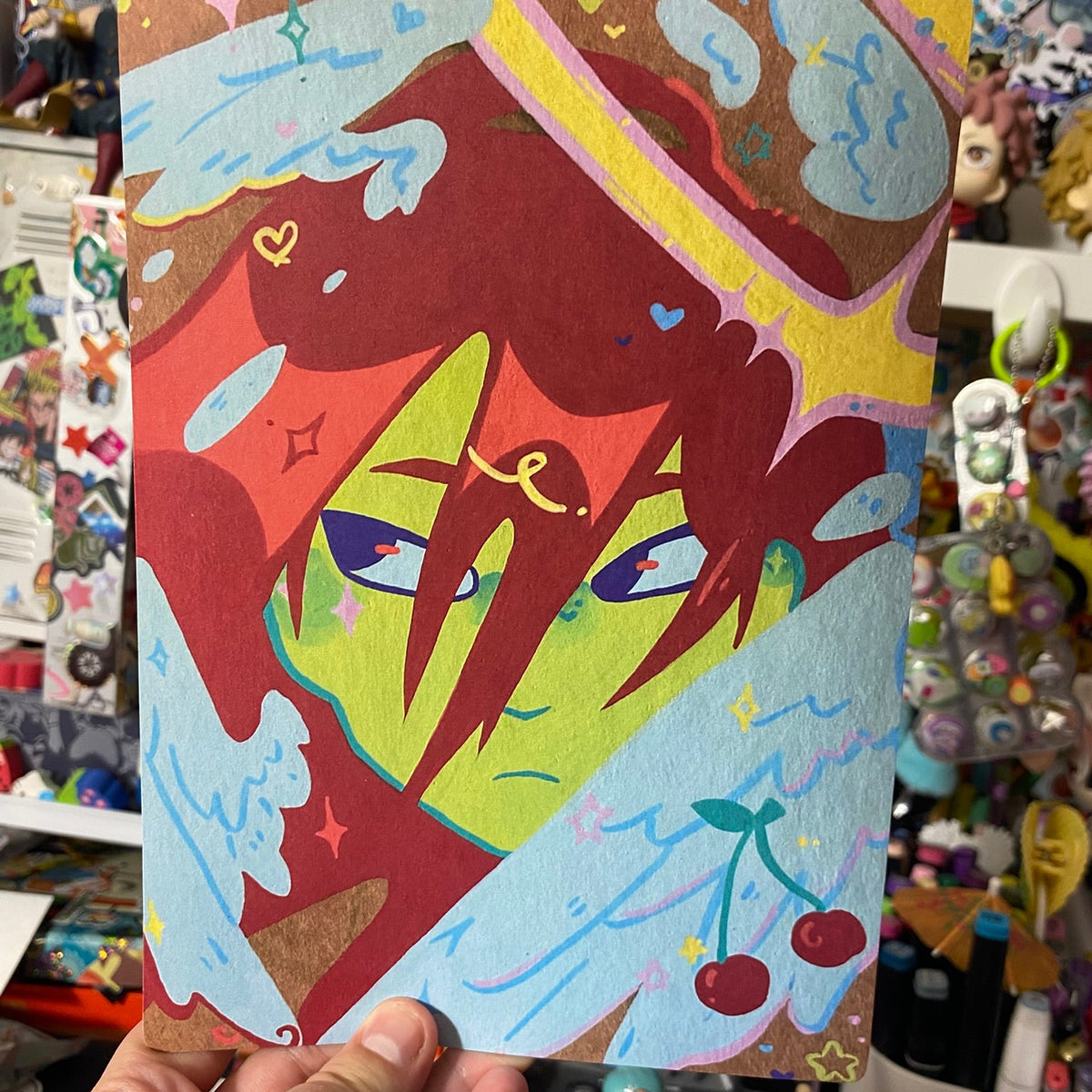 print on craft paper of red hair angel face with wings and cherrys