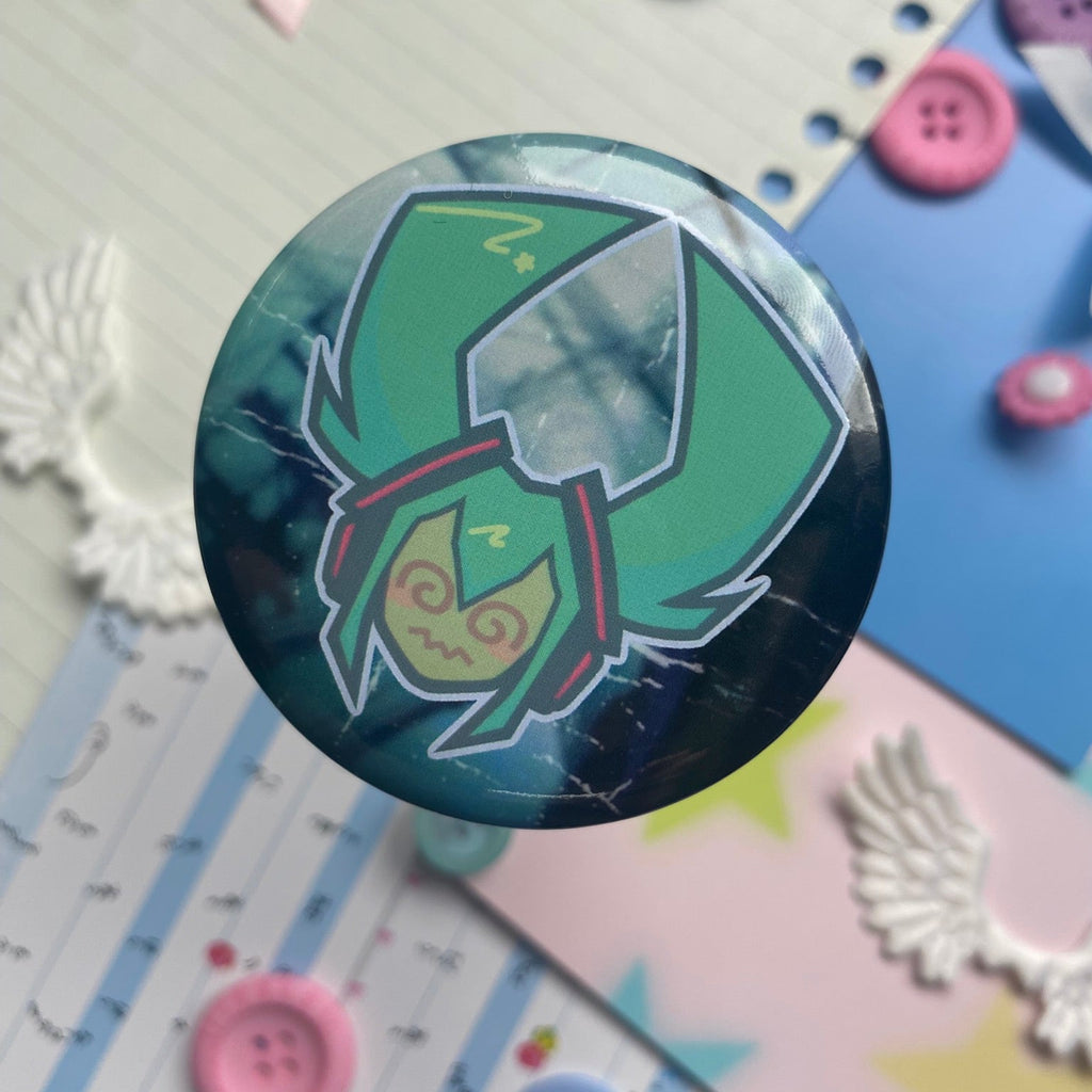 shiny metal round button badge with head shot of anime character with turquoise pig tails