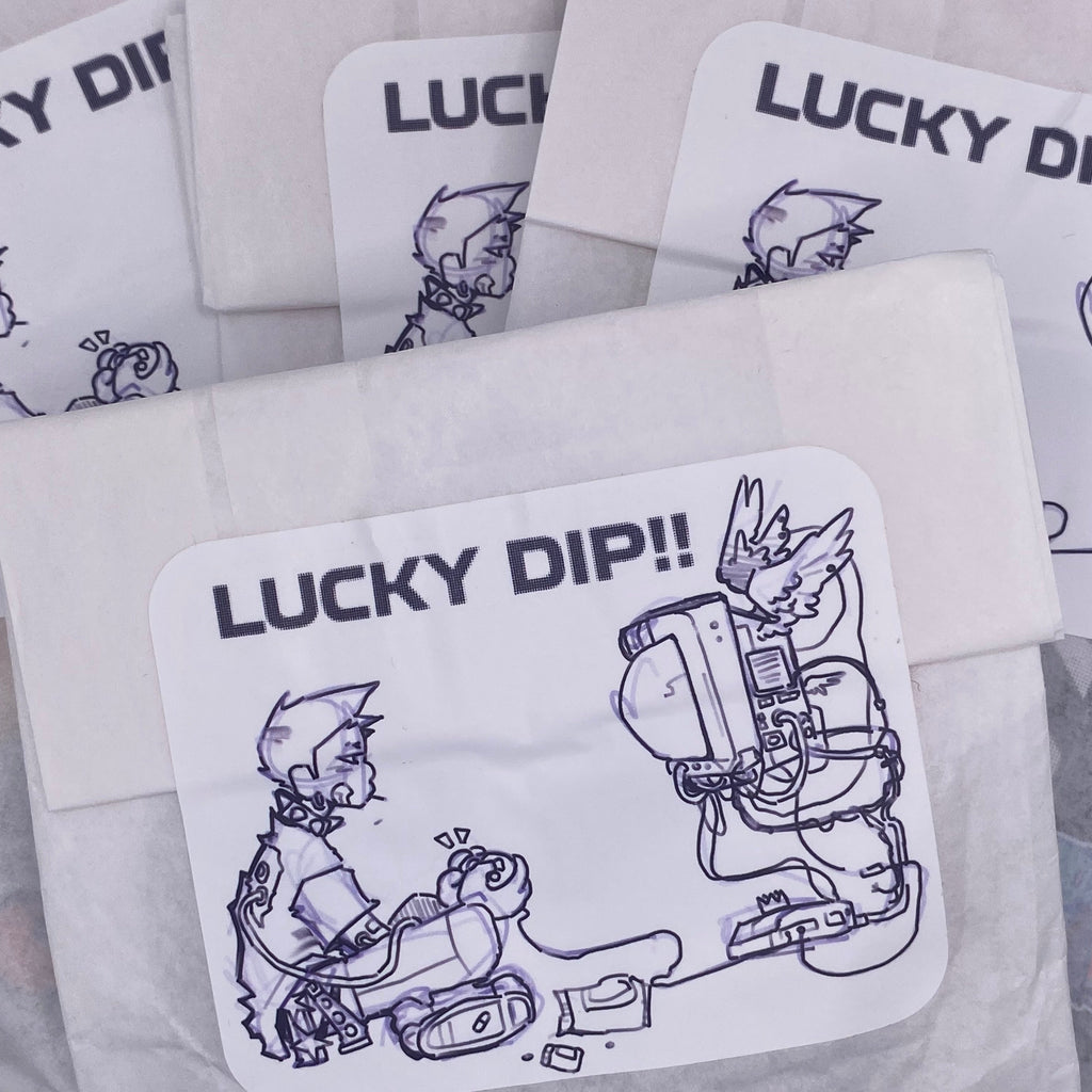 white packet with lucky dip sticker showing Lidia playing video games