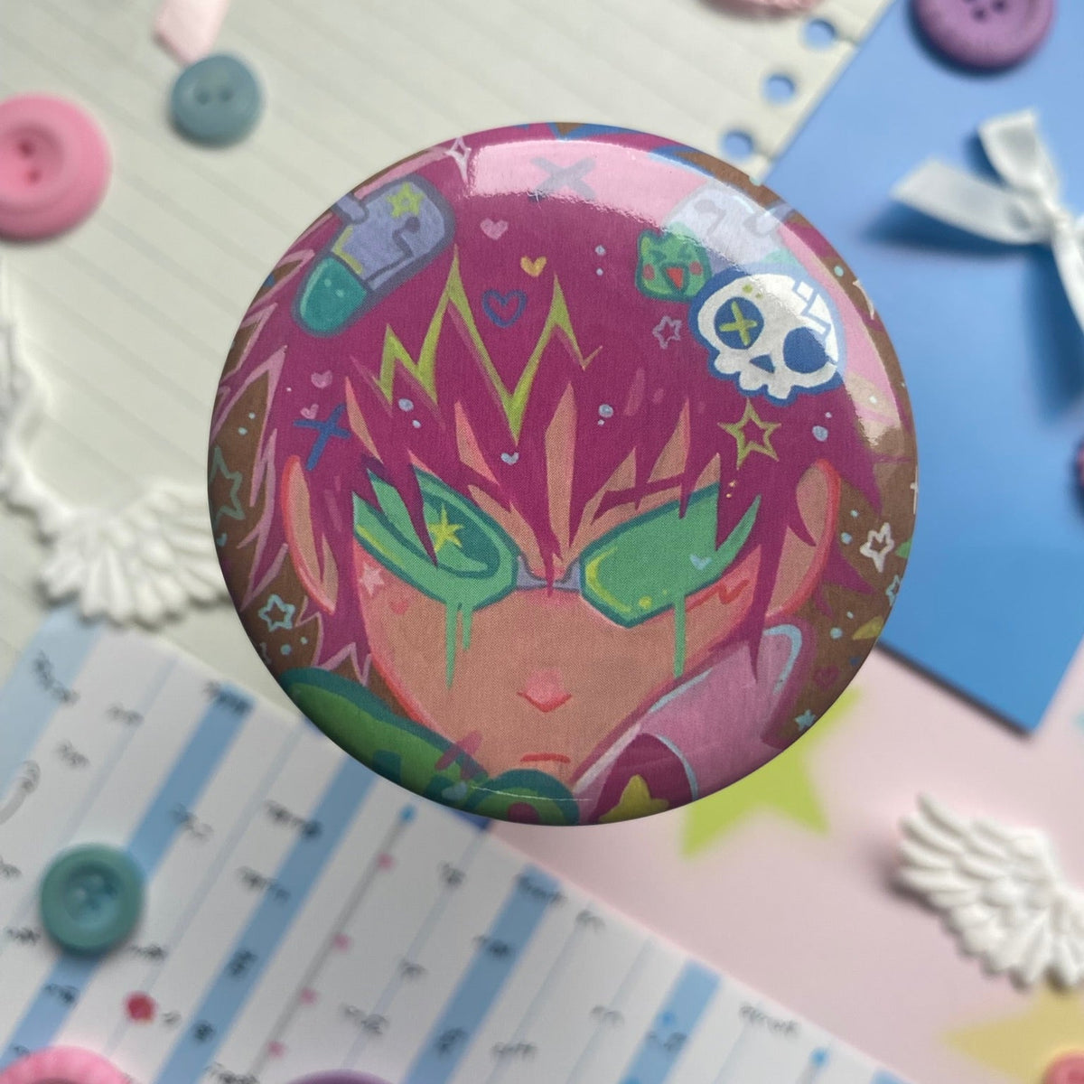 Shiny round button badge with image of pink haired character and green glasses