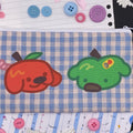 red and green apple dog on blue check zip pouch
