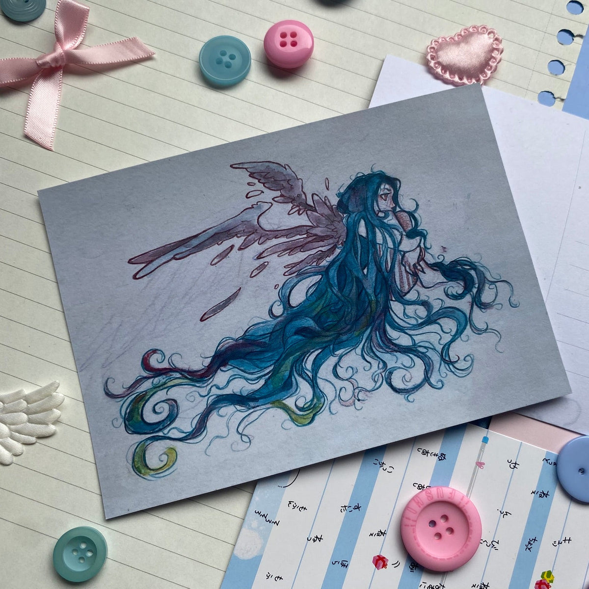 Blue fairy with flowing hair and purple wings hugging their knees