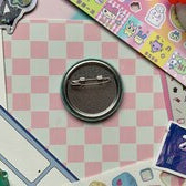 metal back of badge with safety pin