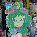 head sticker of cyber singer with green hair and headphones