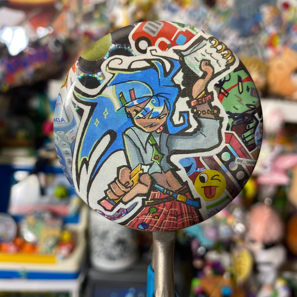 round button badge with tartan punk character with blue hair 