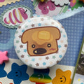 brown dog shaped toast on a round badge